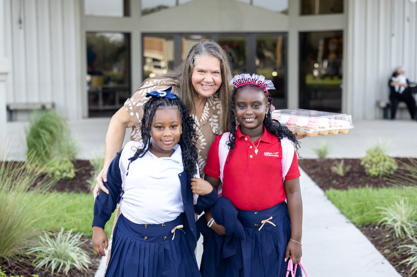 A teacher with students at Jubilee Christian Academy