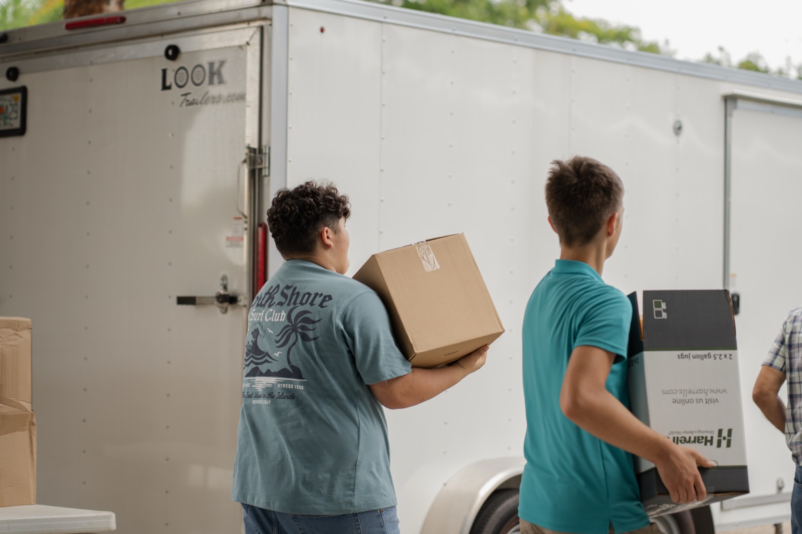 Volunteers unloading supplies for outreach